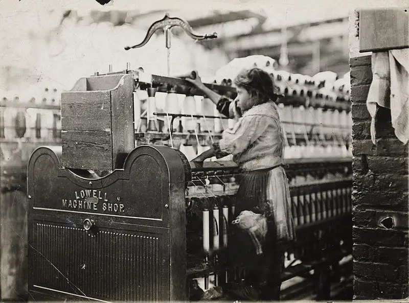 A historical picture of a girl in a textile factory
